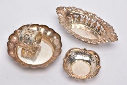 A SELECTION OF SILVER BONBON DISHES AND A NAPKIN RING, to include a wavy rim dish hallmarked