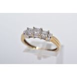 A 14CT GOLD THREE STONE DIAMOND RING, designed with a row of three claw set princess cut diamonds,