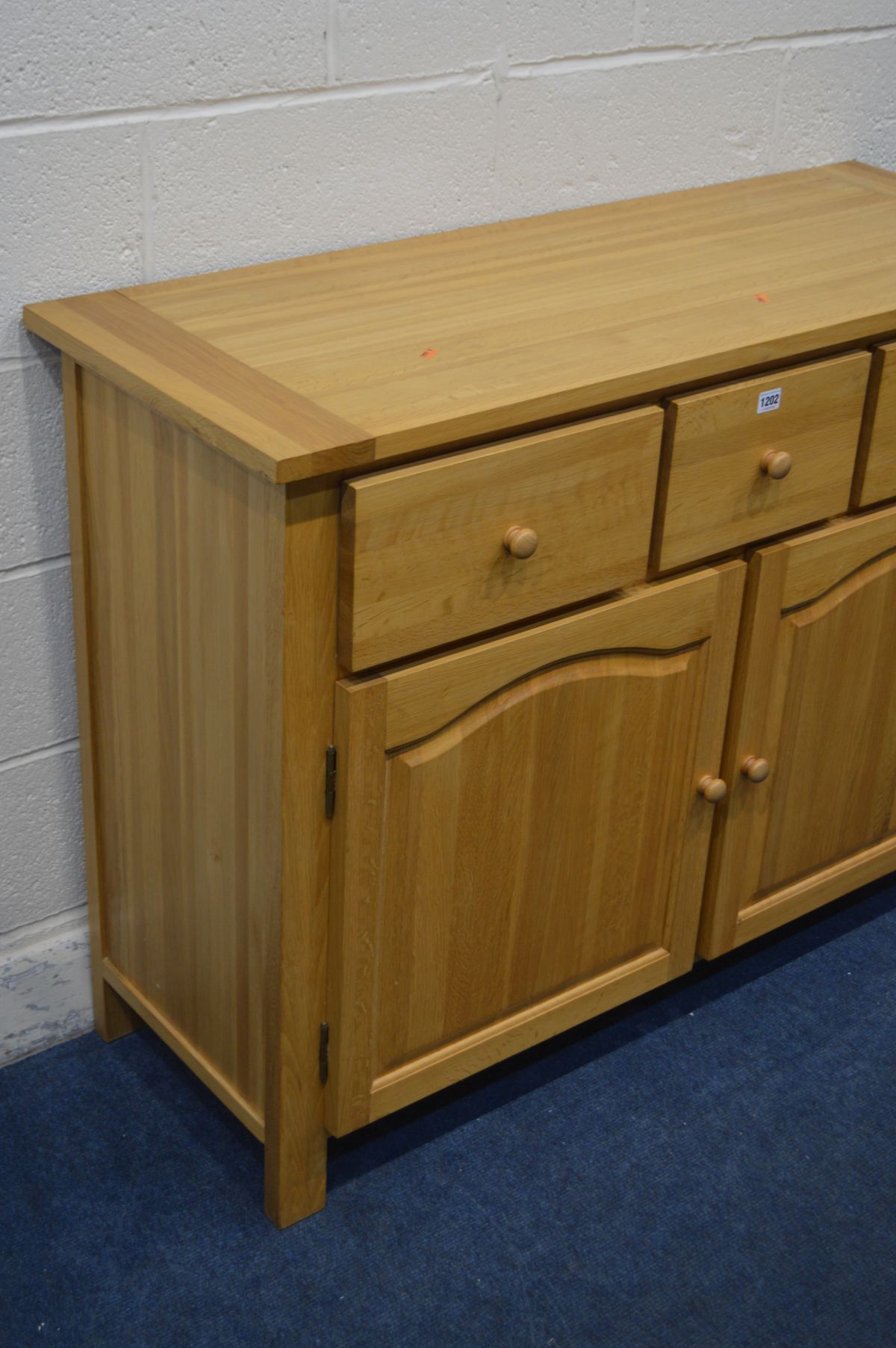 A SOLID LIGHT OAK SIDEBOARD, with three drawers, width 120cm x depth 45cm x height 90cm - Image 2 of 2
