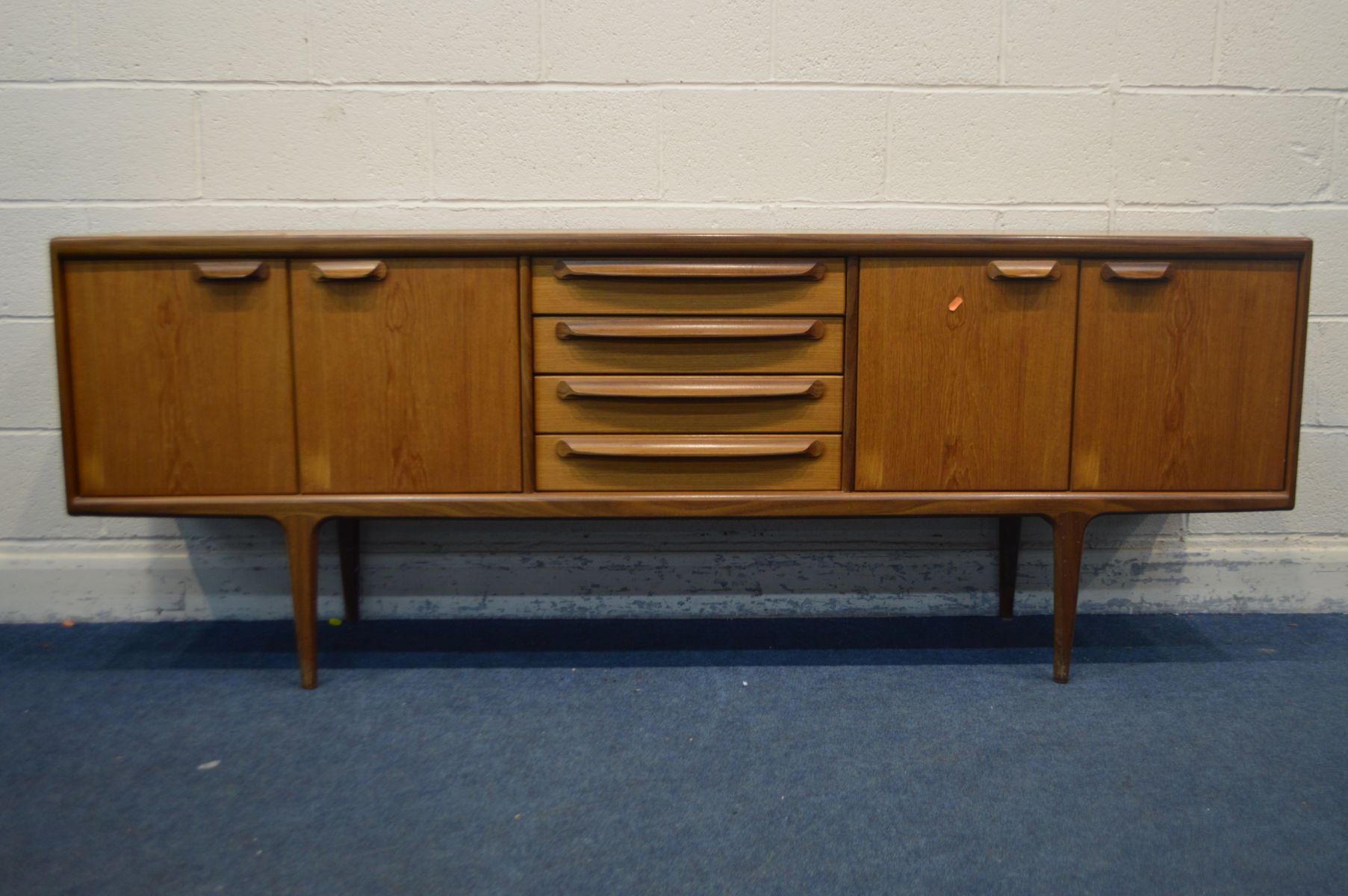 JOHN HERBERT FOR YOUNGER, A 1960'S TEAK 7FT SIDEBOARD, with double cupboard doors flanking four - Image 2 of 5