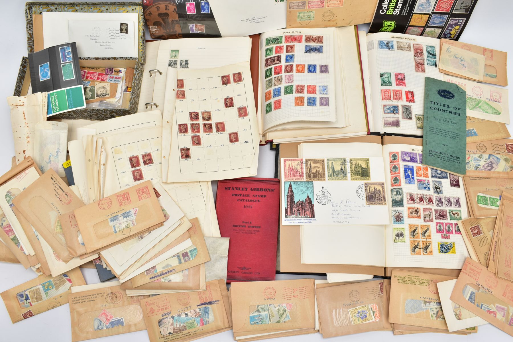 A BOX OF STAMPS IN SIX ALBUMS AND LOOSE in packets, plenty to sort through