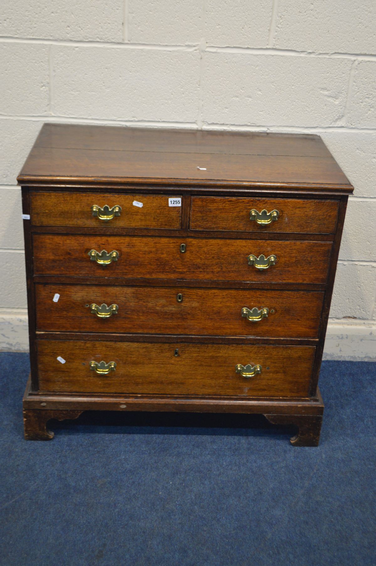 A GEORGIAN OAK CHEST OF TWO OVER THREE LONG GRADUATING DRAWERS, incorporating 20th century