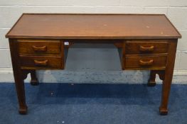 AN EARLY TO MID 20TH CENTURY OAK OFFICE DESK, with four drawers, width 135cm x depth 58cm x height