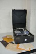 A VINTAGE WIND UP PORTABLE LINGUAPHONE RECORD PLAYER with accompanying educational material