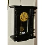 A LATE 19TH CENTURY GERMAN WALL CLOCK, ebonised case with half columns flanking the glazed door, the