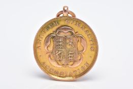 A 9CT GOLD FOB MEDAL, of a circular form, decorative shield and flower for the 'Amateur Gymnastic