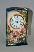 A MOORCROFT POTTERY QUARTZ MANTEL CLOCK OF RECTANGULAR FORM, decorated in the Sweet Briar pattern,