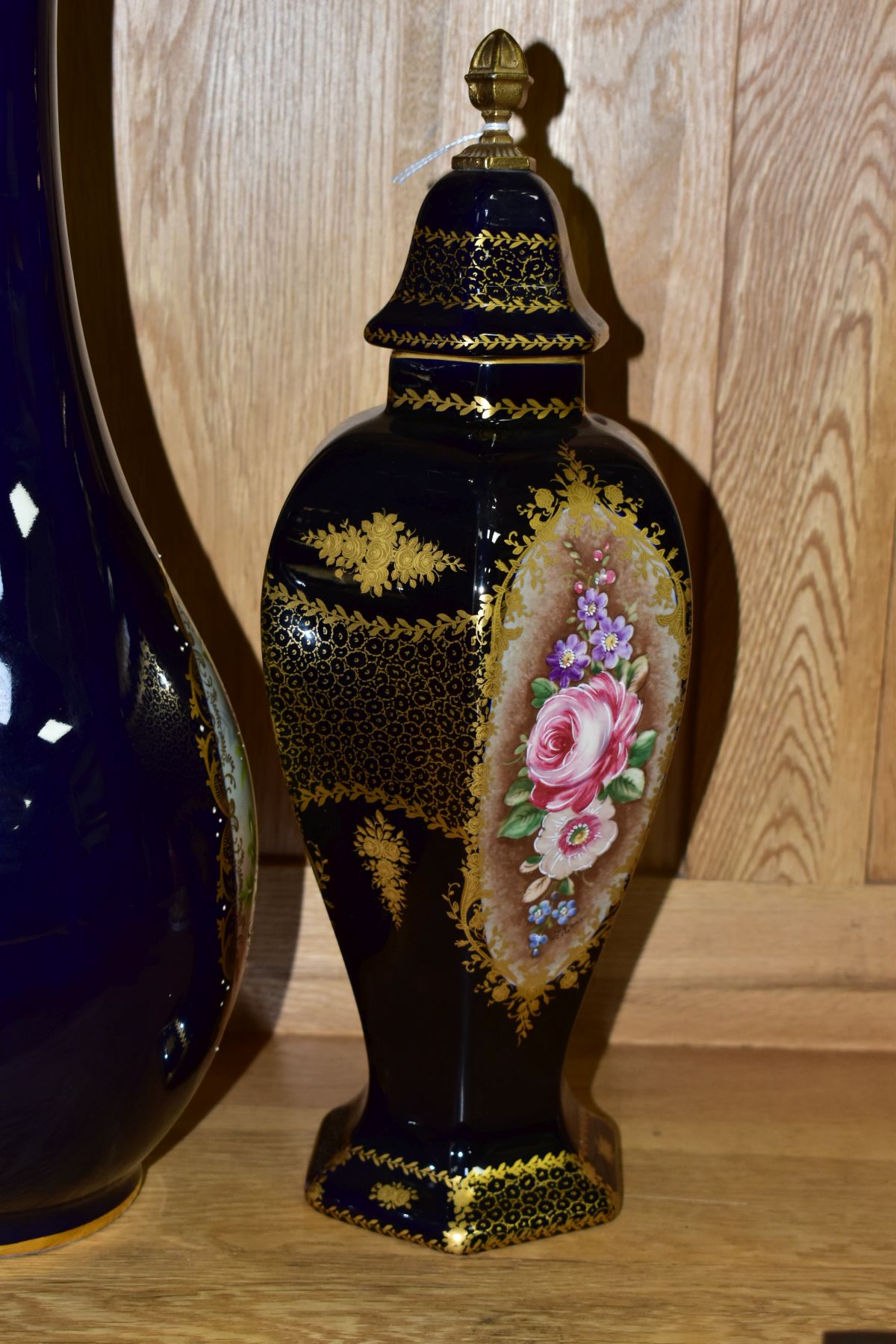 A PAIR OF LIMOGES VASES AND COVERS, with hand painted floral panels and gilt detailing on a dark - Image 7 of 20