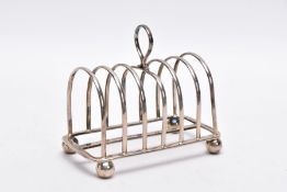 A SILVER GEO. V TOAST RACK, of a plain polished design, loop handle, raised on four ball feet,