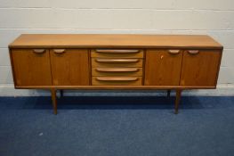 JOHN HERBERT FOR YOUNGER, A 1960'S TEAK 7FT SIDEBOARD, with double cupboard doors flanking four