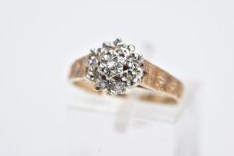 A 9CT GOLD DIAMOND CLUSTER RING, designed with a raised cluster set with star set single cut