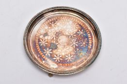 A SILVER SALVER, plain circular form with a beaded rim, raised on three ball and claw feet,