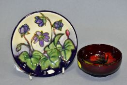 A MOORCROFT POTTERY CIRCULAR PIN TRAY DECORATED IN THE CYCLAMEN PATTERN, design by Emma Bossons,