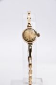 A LADIES 9CT GOLD WRISTWATCH, round gold dial, possibly signed 'Shield' but with letters missing,