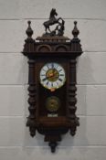 A MAHOGANY VIENNA WALL CLOCK, with a resin horse (missing tail) height 97cm (winding key)