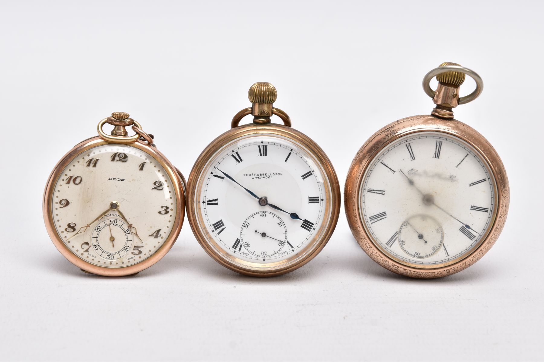 THREE GOLD PLATED OPEN FACED POCKET WATCHES, the first with a white dial signed 'Eros', Arabic