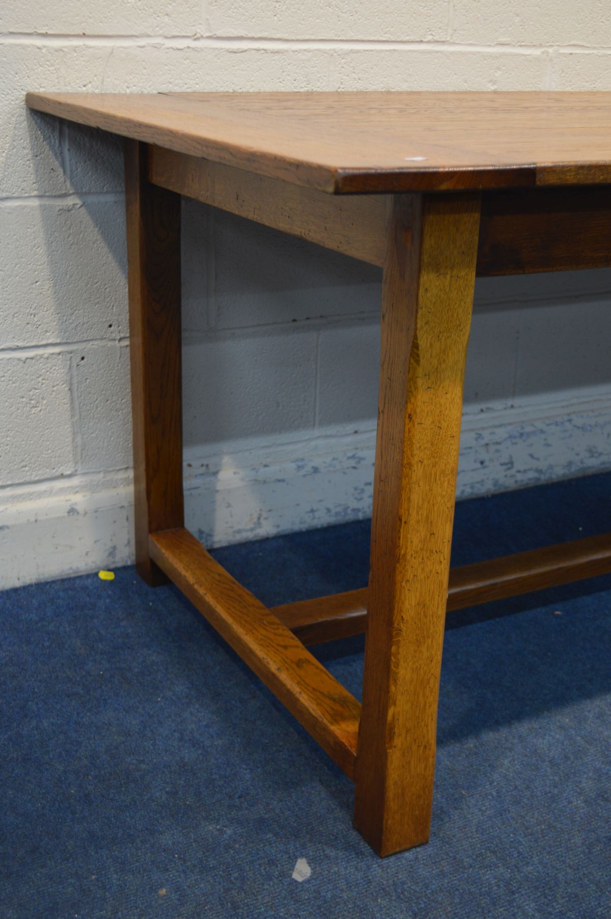 A REPRODUCTION OAK REFECTORY TABLE, in an 18th century style, plank top, on chamfered legs united by - Image 3 of 3