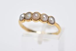 A YELLOW METAL SPLIT PEARL HALF ETERNITY RING, designed with a row of five split pearls, each within