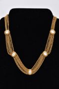 A PIERRE LORION BRASS TONE NECKLET, a multi strand necklace of rope twist, ball link and snake
