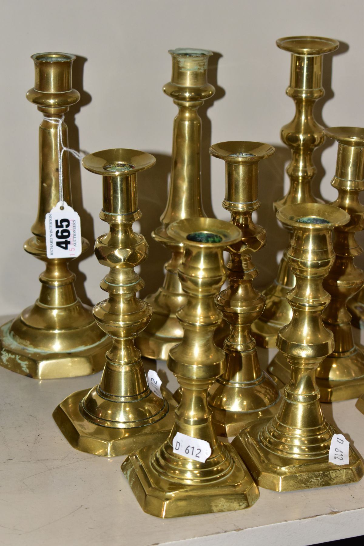 SIX PAIRS OF BRASS CANDLESTICKS, tallest height 22cm and smallest height 16cm, all fitted with - Image 2 of 5