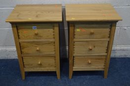 A PAIR OF SOLID LIGHT OAK THREE DRAWER BEDSIDE CABINETS