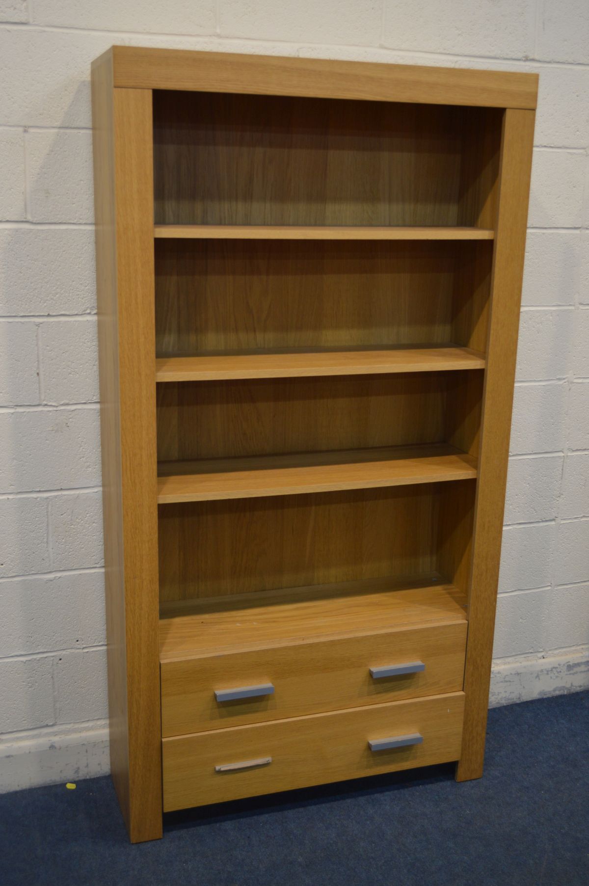 A MODERN OAK FINISH OPEN BOOKCASE, with three shelves above two drawers, width 101cm x depth 33cm