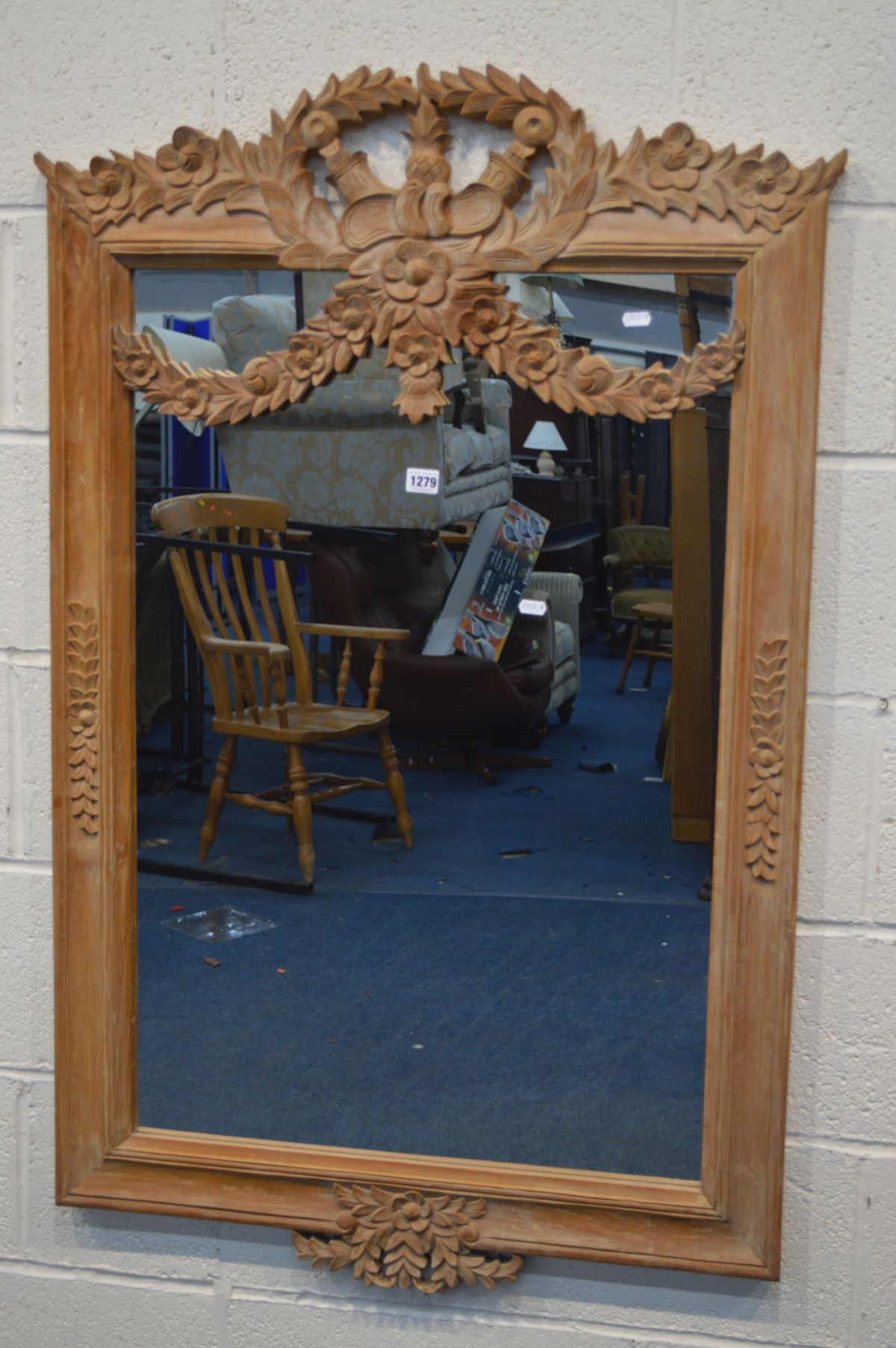 A FOLIATE CARVED BEECH WALL MIRROR, width 79cm x height 123cm