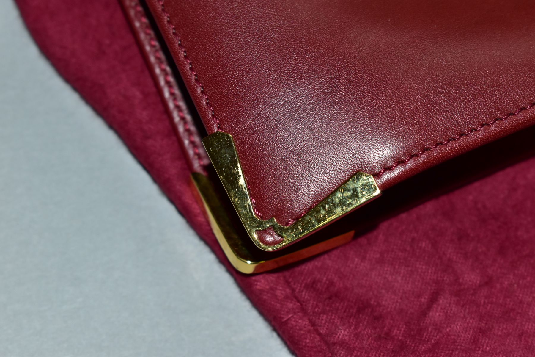 A CARTIER RED LEATHER SOFT BRIEFCASE, case has indentations to the exterior, width 41cm x height - Image 4 of 5