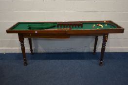 A LATE VICTORIAN MAHOGANY BAR BILLARDS GAME, on a separate extending base, on turned legs, along