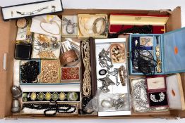 A BOX OF ASSORTED ITEMS, to include a silver oval locket decorated with an embossed foliate