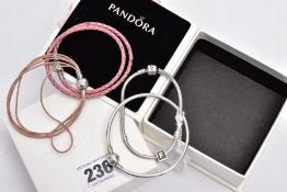 FOUR PANDORA CHARM BRACELETS, to include a snake bracelet fitted with a triangular charm with the