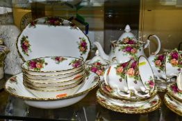 A ROYAL ALBERT OLD COUNTRY ROSES PART DINNER AND TEA SERVICE, comprising teapot (first) milk jug (