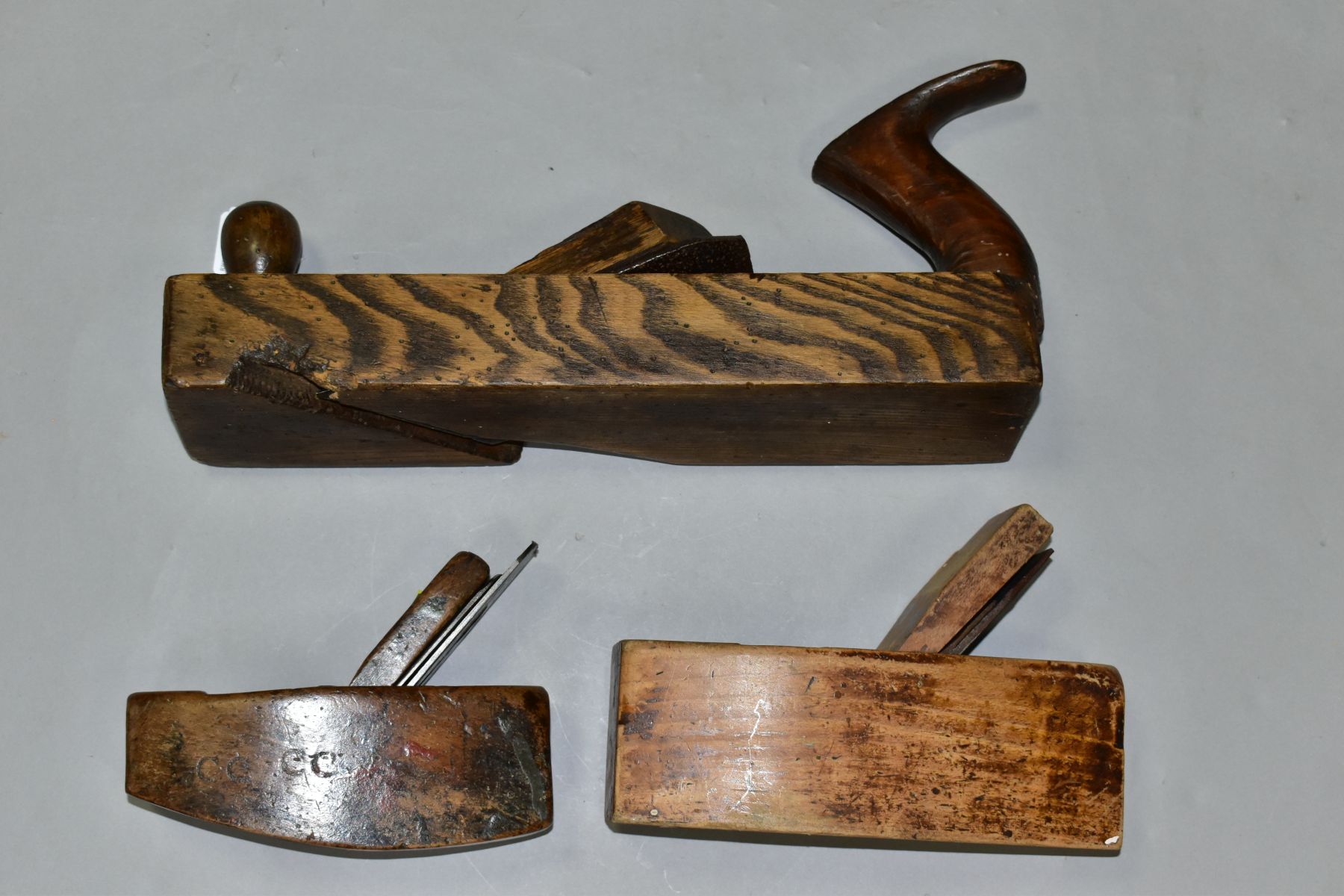 THREE VINTAGE WOODEN PLANES comprising of a 14'' with an angled blade, a 8'' coffin by Atkins and - Image 6 of 9