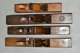 FOUR LARGE WOODEN WOODEN PLANES, comprising of a 21'' with a Sorby iron, a 22'' with a Thos.