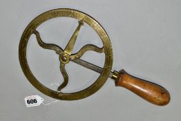 A VINTAGE BRASS WHEELWRIGHTS TRAVELLER, 24 inches increments 7 5/8 inch diameter