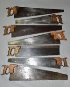 A BOX CONTAINING SEVEN LARGE VINTAGE SAWS, including a 22'' Atkins & Sons iron backed, a 22''