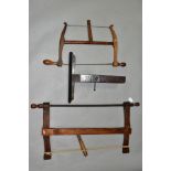 A VINTAGE 21 INCH BOW SAW, a 14 inch bow saw and a vintage 14 inch hand made mahogany saw vice (3)