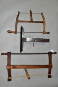 A VINTAGE 21 INCH BOW SAW, a 14 inch bow saw and a vintage 14 inch hand made mahogany saw vice (3)