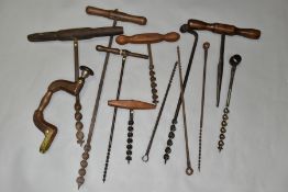 A SELECTION OF VINTAGE WOOD BORING TOOLS, including an oak brace, five T-Auger, a T reamer and other