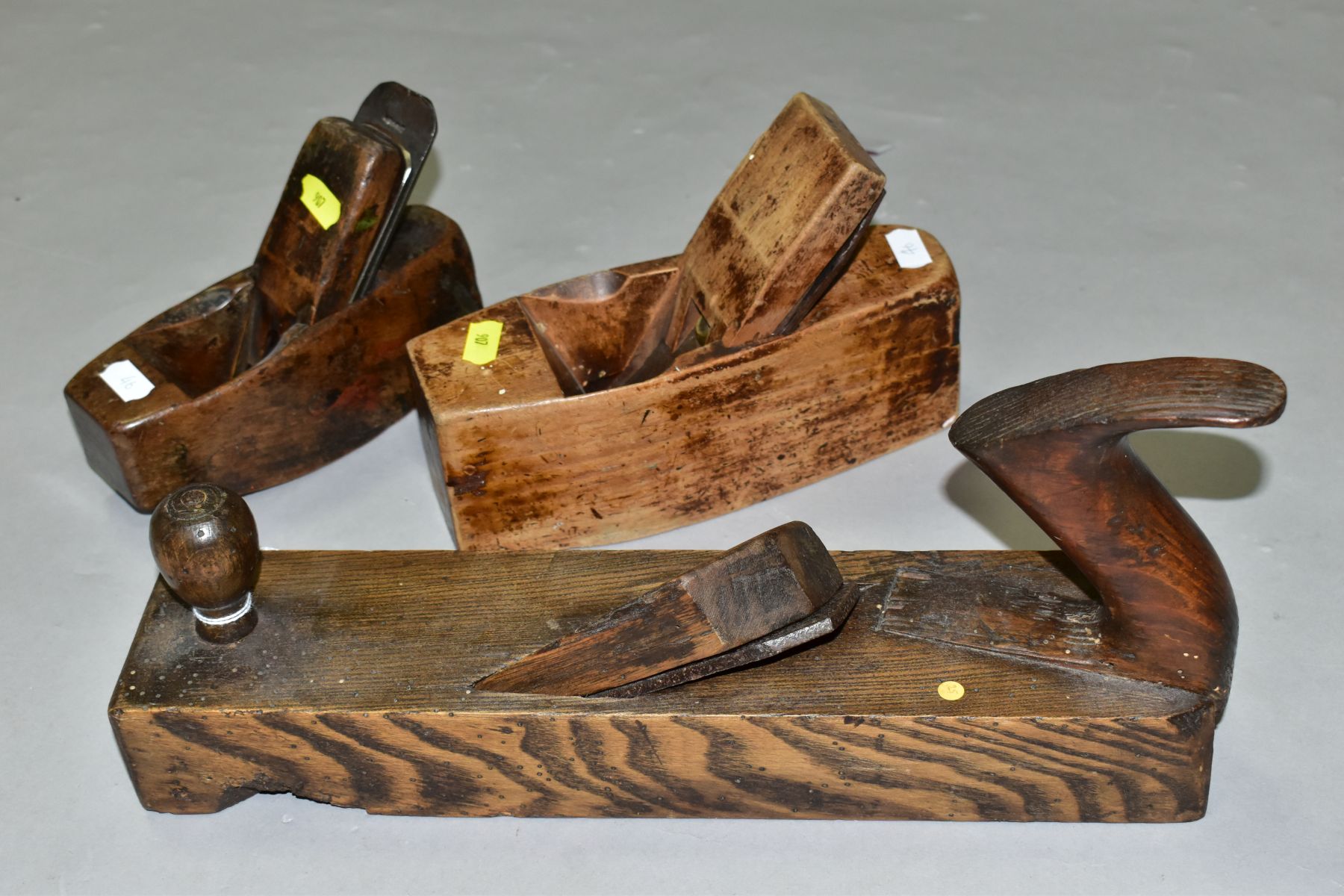 THREE VINTAGE WOODEN PLANES comprising of a 14'' with an angled blade, a 8'' coffin by Atkins and - Image 4 of 9