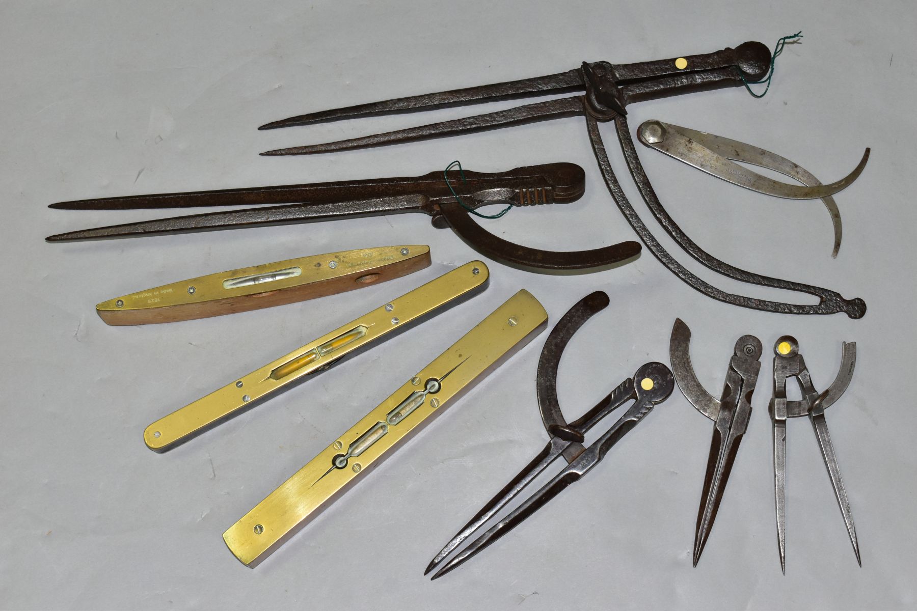 SIX VINTAGE DIVIDERS AND THREE SPIRIT LEVELS, including a Rabone & Chesterman 9'' level, a