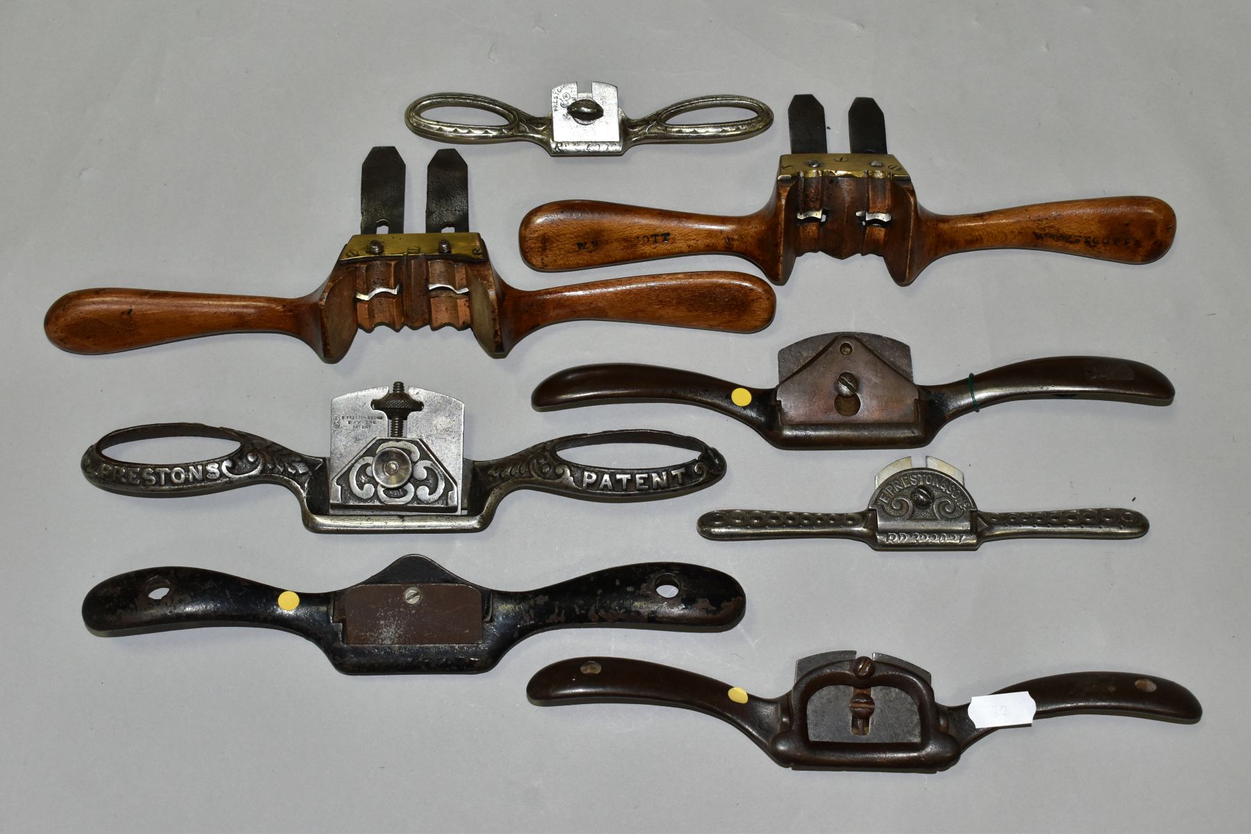 A TRAY CONTAINING EIGHT SPOKESHAVES, including two fruitwood Ovolo Sash Shaves (one left hand and