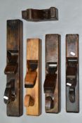 A BOX CONTAINING FOUR VINTAGE WOODEN PLANES including one at 22'' with a Marples iron, a 17'' with