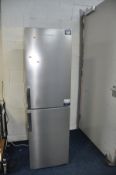 A GRUNDIG STAINLESS STEEL FRONTED FRIDGE FREEZER 55cm wide 181cm high (PAT pass and working at 4 and