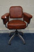 AN INDUSTRIAL TANSAD SWIVEL CHAIR with red leatherette upholstery, adjustable pivot back, on