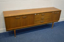 A 1950'S/60'S AFROMOSIA SIDEBOARD, with double cupboard doors, and a fall front door flanking