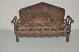 A VINTAGE CAST IRON FIRE BASKET with scrolled wrought iron front and sides , plain arched back and