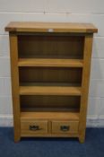 A SOLID LIGHT OAK OPEN BOOKCASE, with three fixed shelves, above two drawers, width 80cm x depth