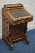 A LATE VICTORIAN BURR WALNUT DAVENPORT, with a brass gallery hinged top, fitted interior, green