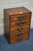 A SMALL OAK BANK OF FIVE DRAWERS, with drop handles, width 27cm x depth 19th x height 36cm